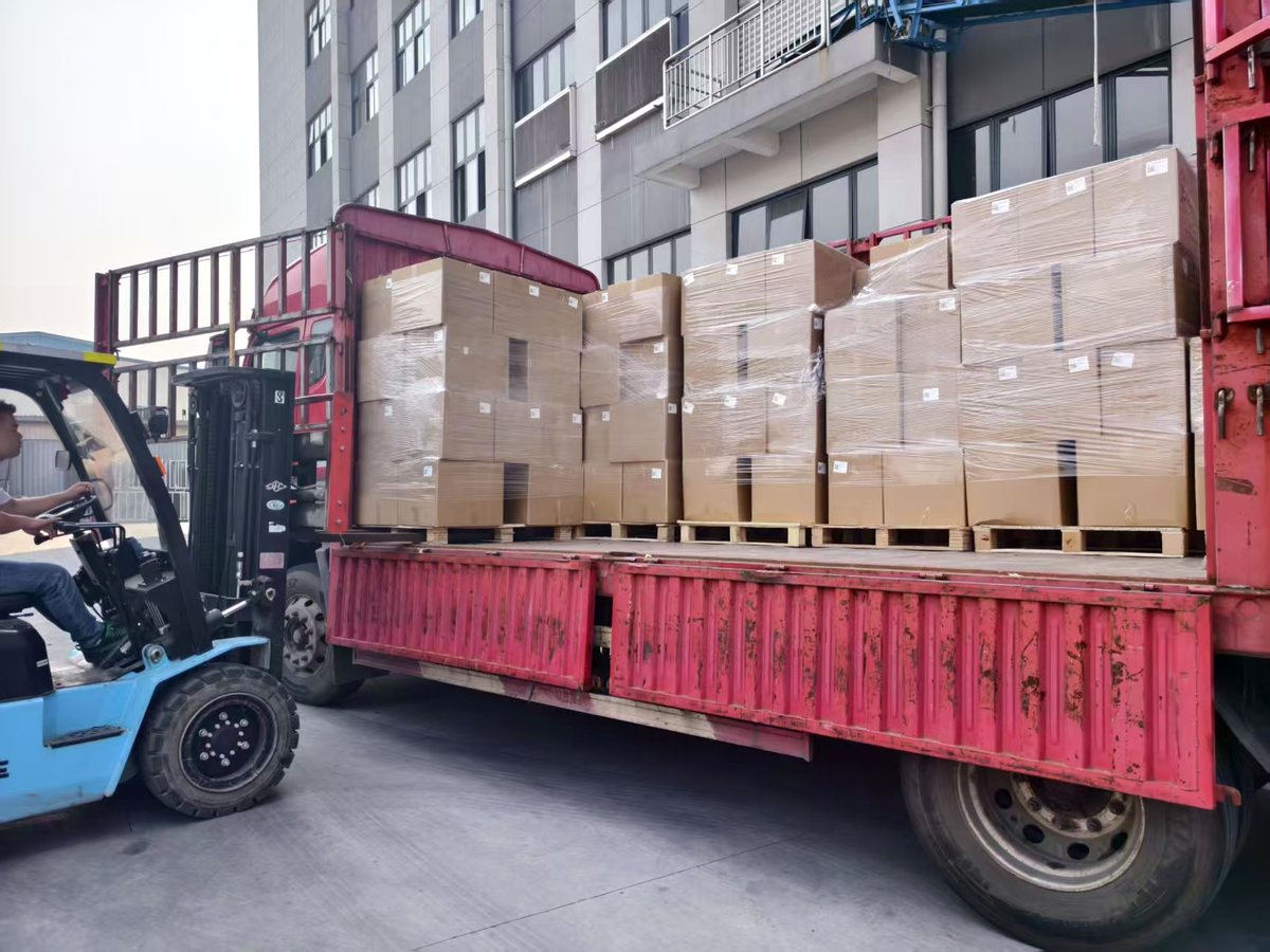 Forklift loading cartons onto a truck in China