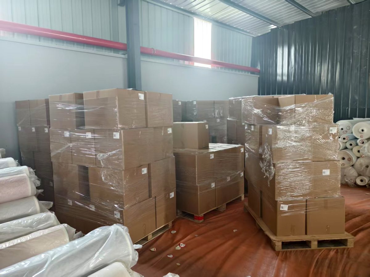 Packed cartons wrapped and staged in a warehouse