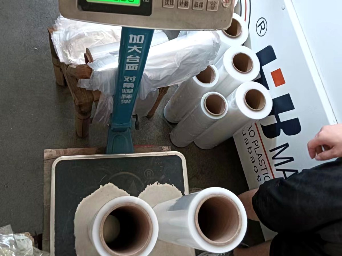 Quality control weight check for packaging film rolls